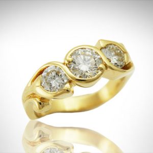14K yellow 3 stone diamond ring with swirl