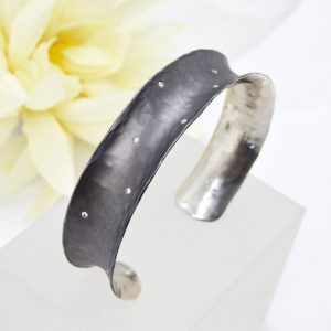 Hammered and oxidized sterling silver cuff with scattered flush-set accent diamonds