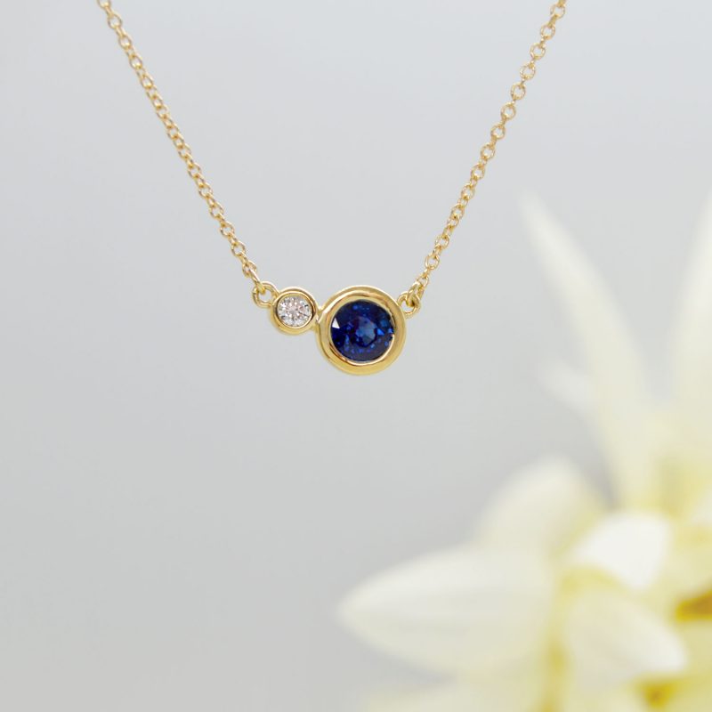 14KY sapphire and diamond bezel contemporary necklace