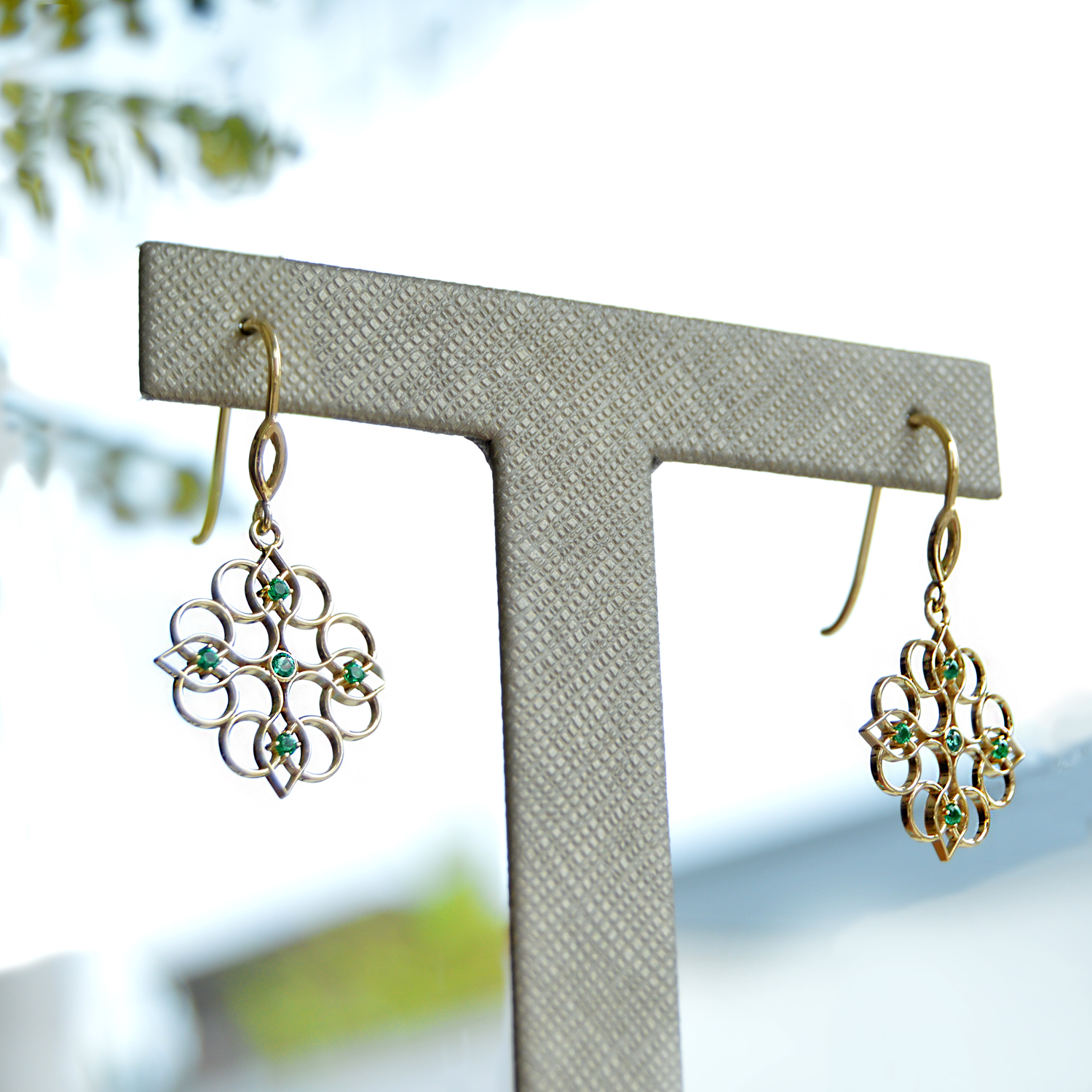 Emerald dangle earrings in 14k yellow gold
