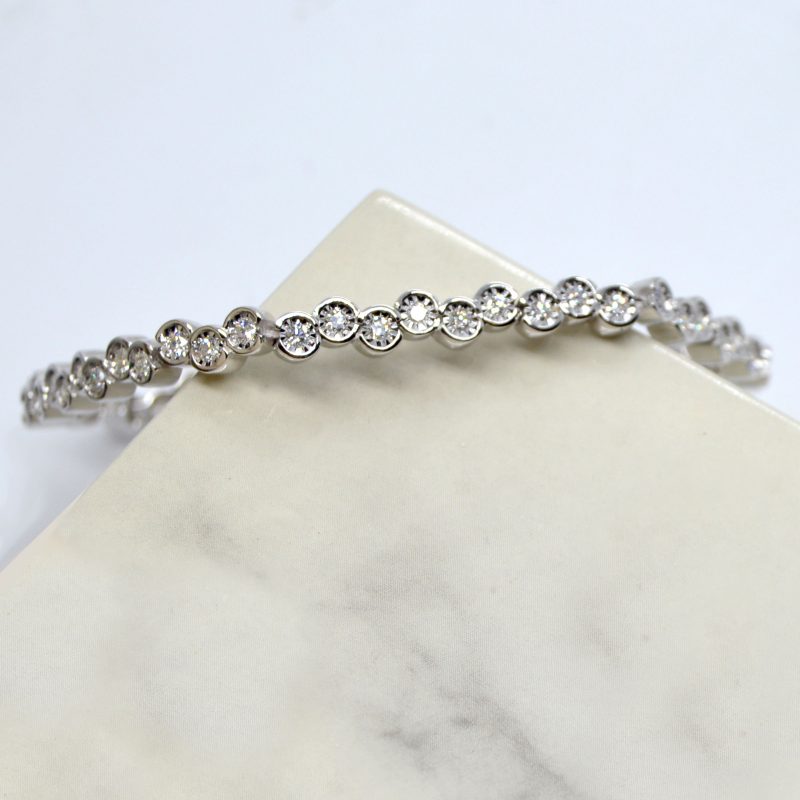 Line bracelet with offset bezels set with diamonds in 14k white gold
