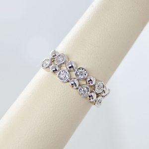 Bubbles bezel and white gold double row ring with diamonds designed by Allison Kaufman