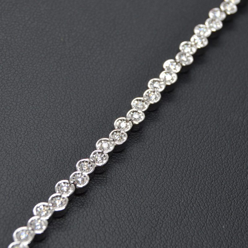 Line bracelet with offset bezels set with diamonds in 14k white gold