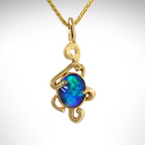 Swirl design custom pendant designed by Morgan's Treasure Custom Jewelry in Westerville, OH with oval black opal blue and green cabochon gemstone in 14k yellow gold