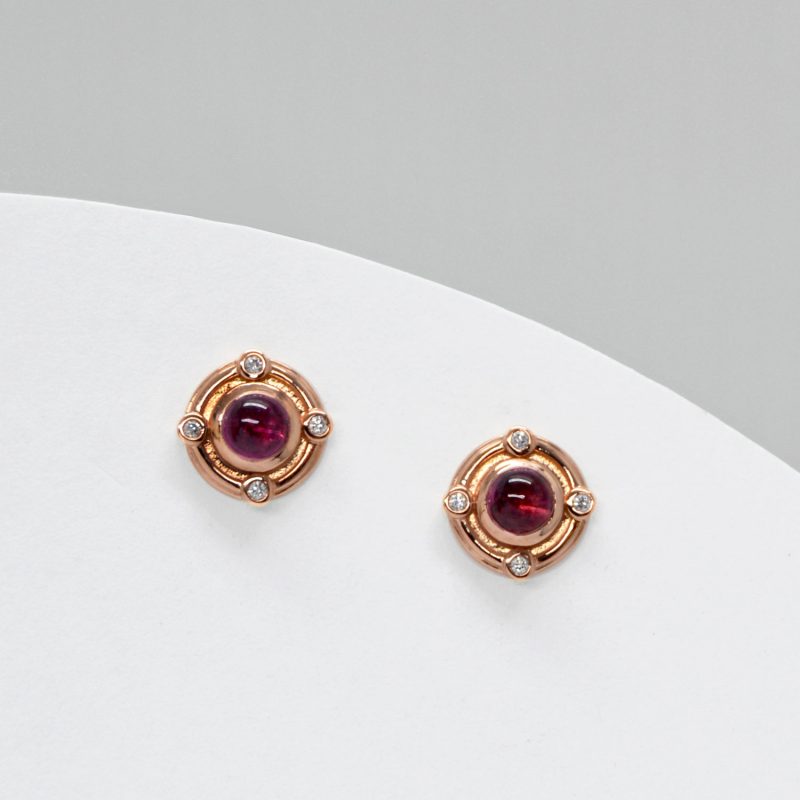 Rhodolite garnet earrings with accent diamonds in 14k rose gold bezel set stud earrings