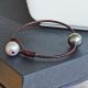 Pearl and leather bracelet with brown leather, freshwater white pearls and a gray Tahitian pearl