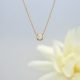 14K yellow gold dainty necklace with round white pearl and accent diamonds on chain