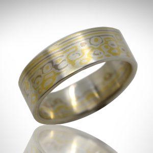 Mokume gane wedding band designed by Morgan's Treasure in 14K white gold, 18k yellow gold and sterling silver with wood grain pattern