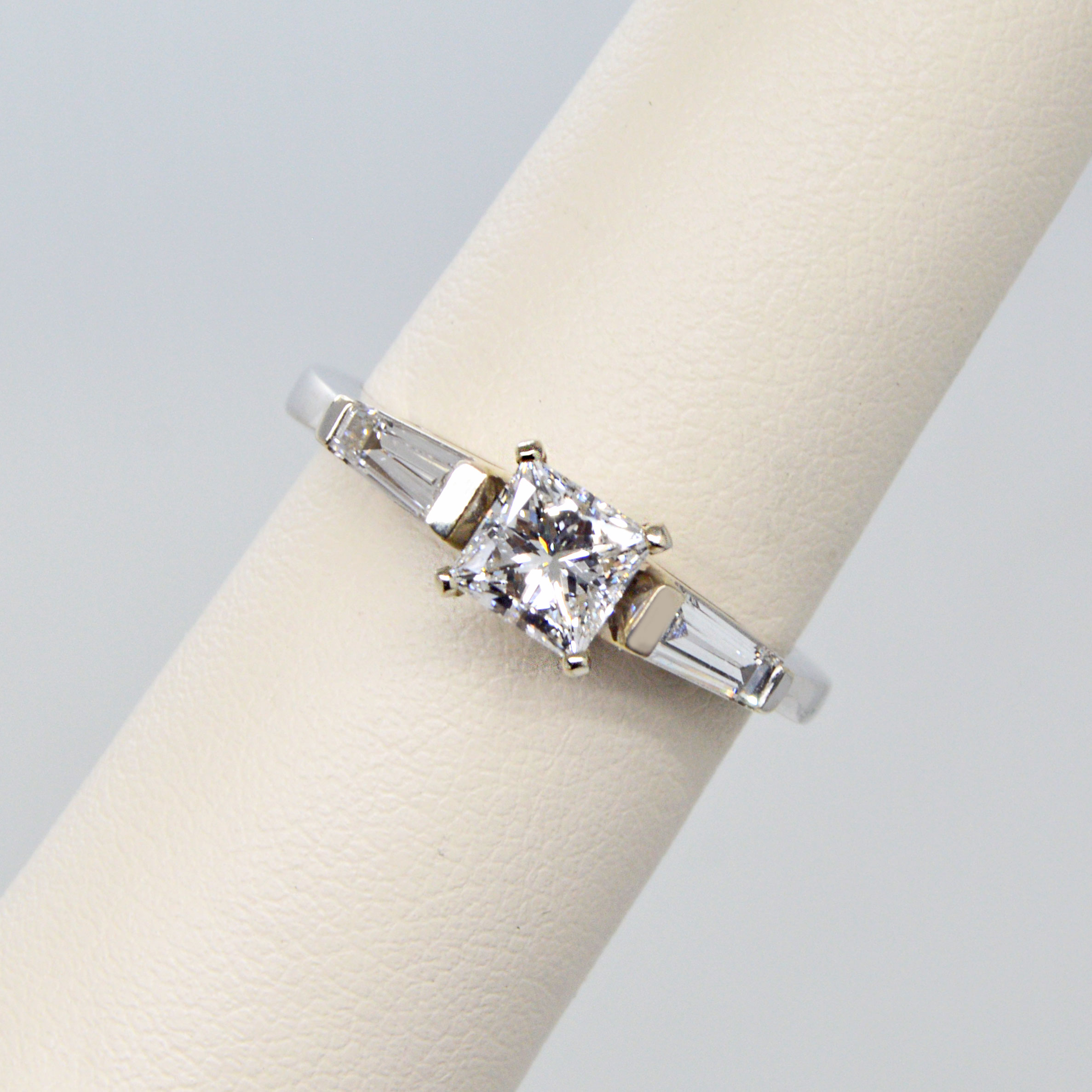 3-stone ring with princess cut center stone and baguette side stones in 14k white gold
