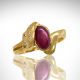 Oval chatoyant ruby cabochon gemstone in 18k yellow gold ring with accent diamonds and satin finish, designed by Morgan's Treasure in Westerville, OH