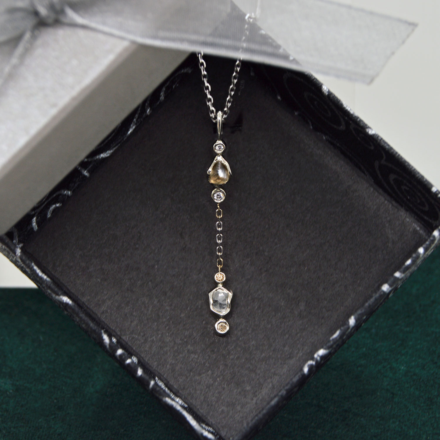 Natural raw diamonds in lariat style pendant with matching chain. 14K white gold with full-cut diamond accents. Designed by Morgan's Treasure in Westerville, OH