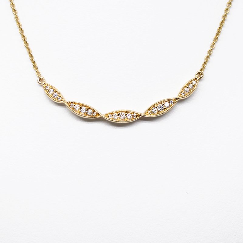 Twist design necklace with pave set diamonds and millgrain detail on 14K yellow gold chain, Allison Kaufman