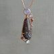 Dinosaur bone gemstone pendant in rose gold with chalcedony, garnets, rainbow moonstones, custom designed by Morgan's Treasure