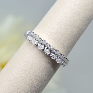 Natural oval-cut diamond band in 14K white gold, designed by Allison Kaufman