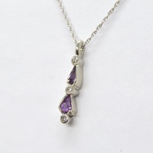 Kite shaped purple sapphire pendant with diamonds, designed by Morgan's Treasure