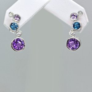 Hydrangea earrings designed by Allison Kaufman in 14k white gold with amethyst, london blue topaz and diamonds in bezel settings