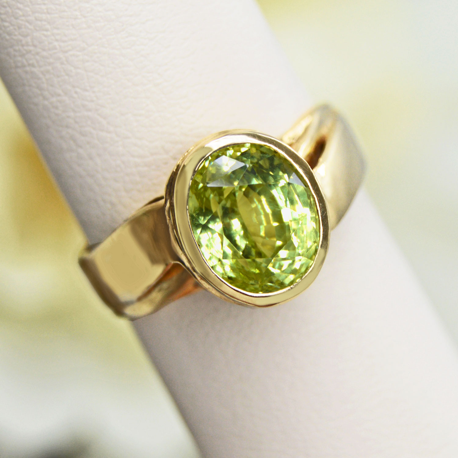 Faceted Chrysoberyl gemstone, bezel-set in a 14Kt yellow gold ring.