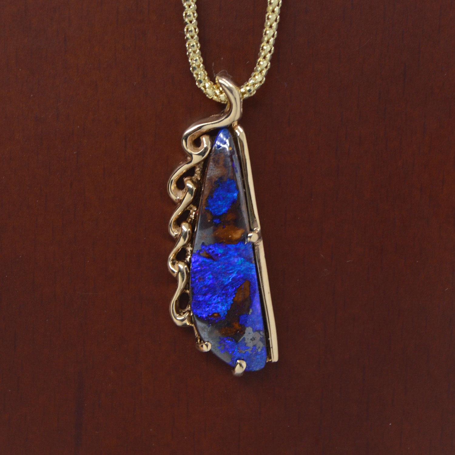 Australian boulder opal pendant custom jewelry with blue and brown gemstone and 14K yellow gold carved pendant made by Morgan's Treasure