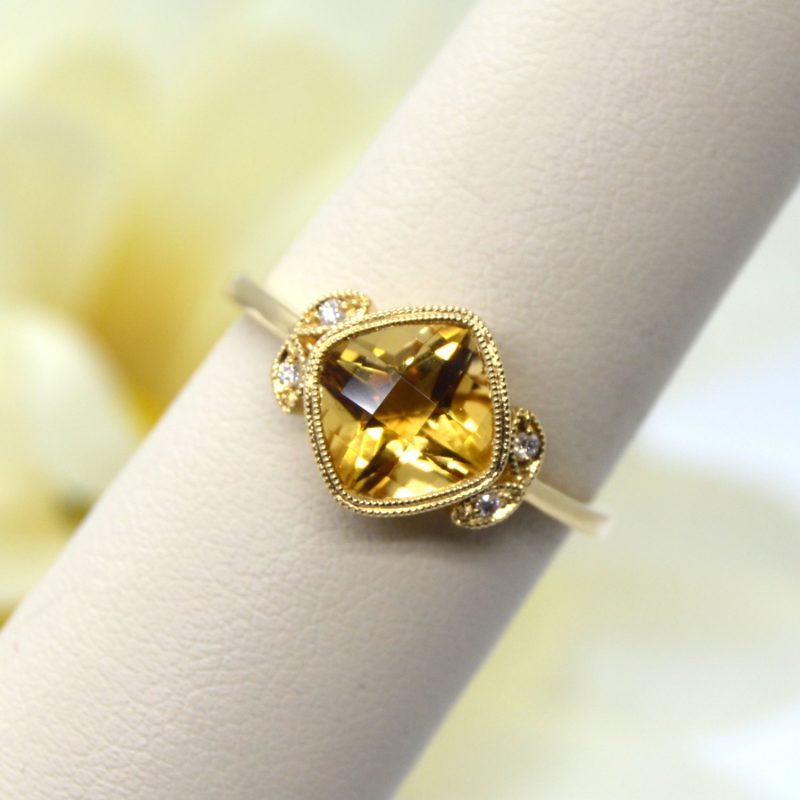 Cushion-cut 8mm Citrine ring with a total of 1.15CT accent diamonds set in 14KT yellow gold from Allison Kaufman.