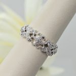 14K white gold floral filigree band ring with diamonds and millgrain detail, designed by Allison Kaufman