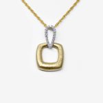 Textured two-tone pendant in 14K with diamonds
