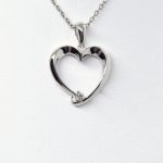 Heart pendant in 14K white gold with accent diamond
