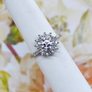 Prong set engagement ring with halo and accent diamonds designed by Morgan's Treasure