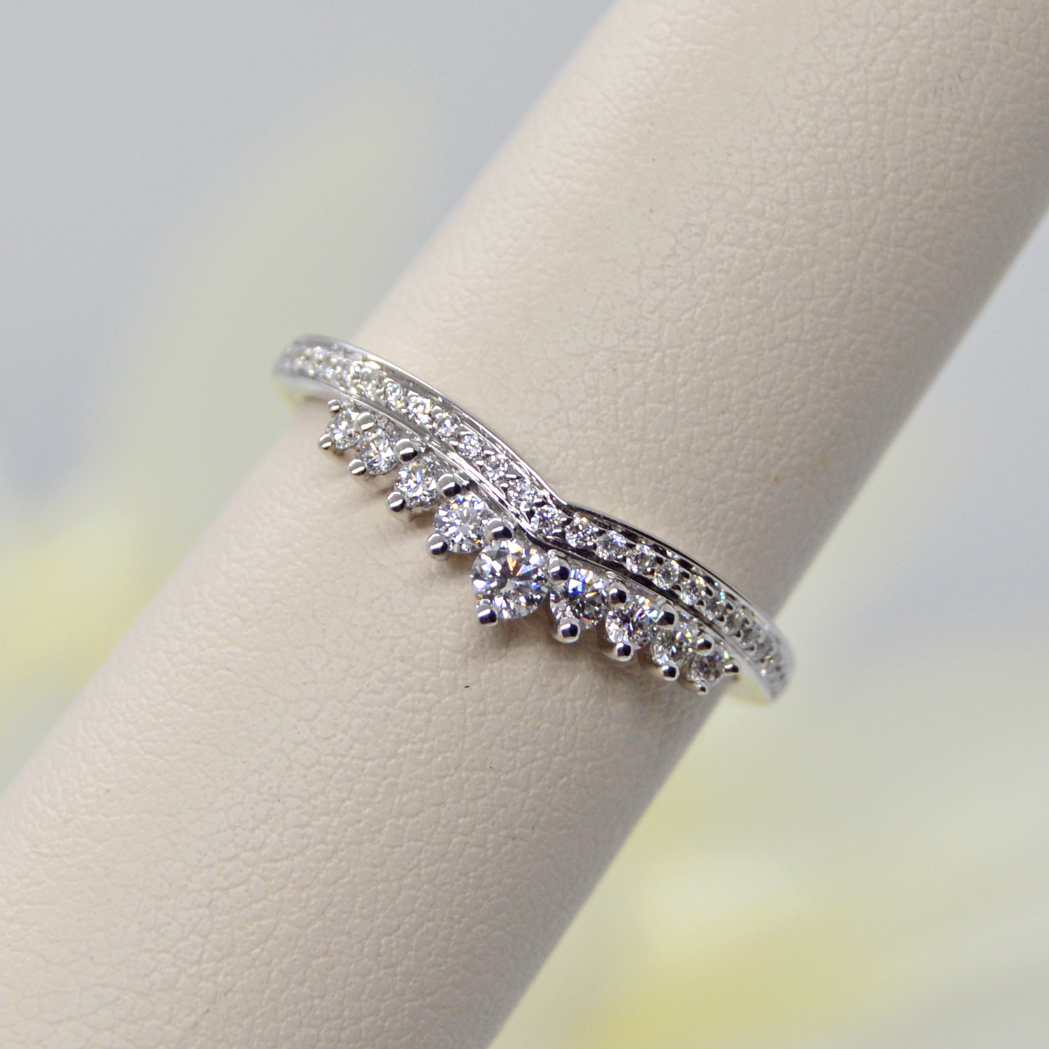 14k white gold ring with v shape shadow band for wedding band, graduated diamonds prong set designed by Allison Kaufman