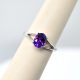 14K white gold ring with split shank and oval amethyst gemstone