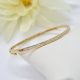 14K yellow gold bracelet with a single row of diamonds, hinged bangle by Allison Kaufman