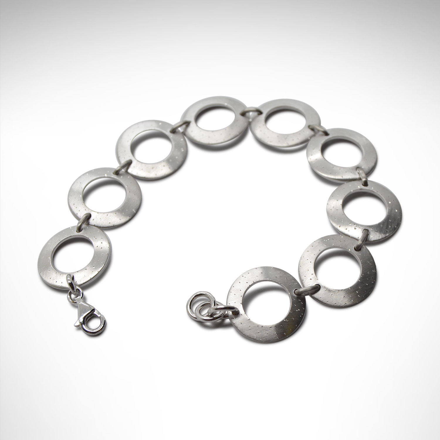 Sterling silver bracelet with circle links in a satin sparkle finish