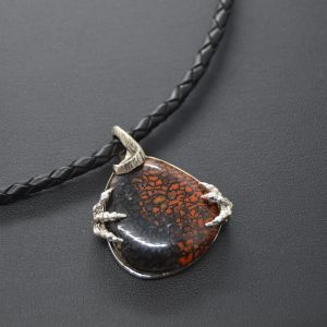 Dinosaur bone gemstone in sterling silver carved pendant on black braided leather cord, designed by Morgan's Treasure