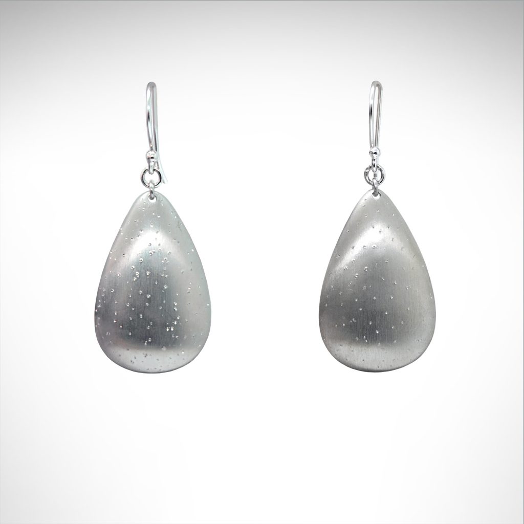 Sterling silver teardrop shaped dangle earrings with satin sparkle finish