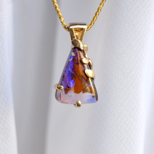 custom triangle purple boulder opal pendant in 14k yellow gold on yellow gold wheat chain, custom designed made by Morgan's Treasure Custom Jewelry in Westerville OH