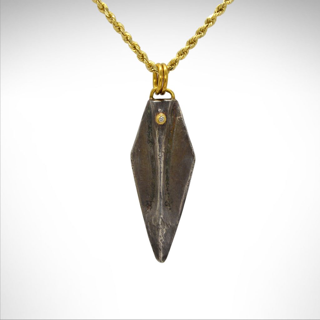 Sterling silver spearhead necklace oxidized with diamond bezel and 24kt gold bail on 14k gold chain