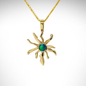 Custom black opal pendant on chain in 14k yellow gold with round black opal in greens and blues, designed by Morgan's Treasure in Westerville, OH