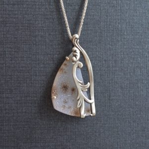 Sterling silver pendant with large dendritic druzy quartz gemstone. Pendant is made from modified antique decorative fork, designed by Morgan's Treasure in Westerville, OH