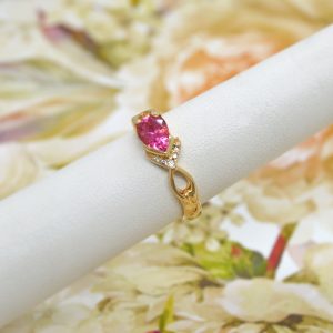 Pink tourmaline pear cut gemstone in 14K yellow gold ring custom designed with accent diamonds