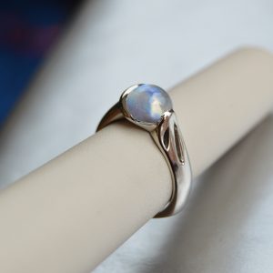 Designed by Morgan's Treasure, Rainbow Moonstone gemstone cabochon ring with crescent moon bezel, in white gold ring