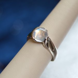 Designed by Morgan's Treasure, Rainbow Moonstone gemstone cabochon ring with crescent moon bezel, in white gold ring