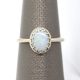 14K white gold ring with crown style prong setting and oval cabochon opal gemstone