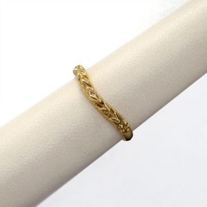 Carved 14KY gold band with curve to fit against engagement ring