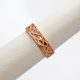 Celtic inspired mens wedding band in 14k rose gold with a braided design