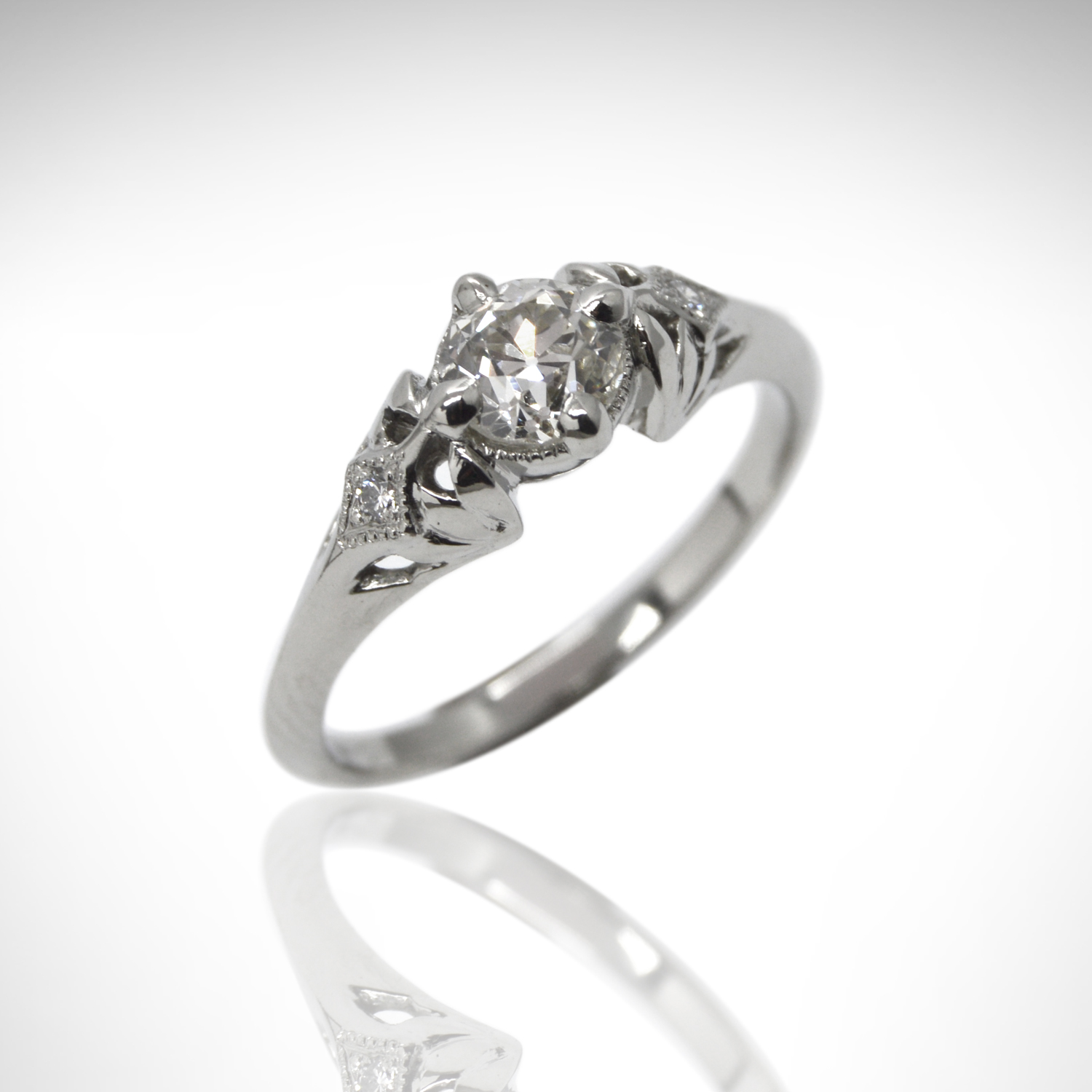 one of a kind engagement ring with old european cut diamond in 14k white gold with edwardian vintage inspired filigree setting and accent diamonds with millgrain detail