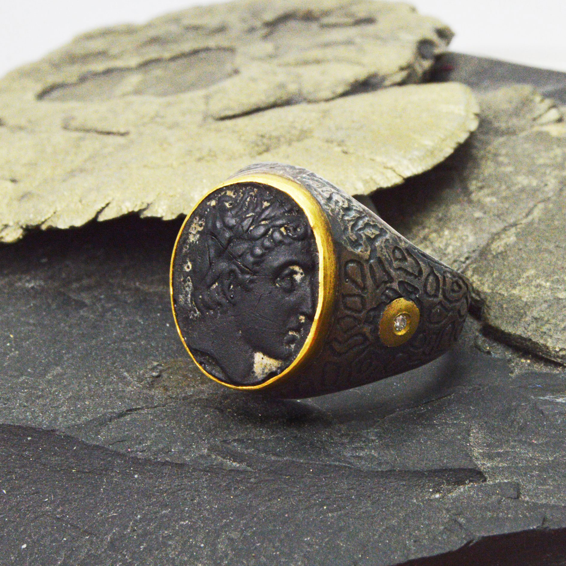 Carv ed onyx ring with intaglio portrait profile, oxidized sterling silver with an accent diamond and 24k gold