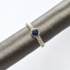 14K white gold ring with rope style shank and bezel set cabochon blue sapphire