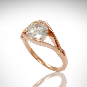 14k Rose gold diamond ring with split shank and twist detail.